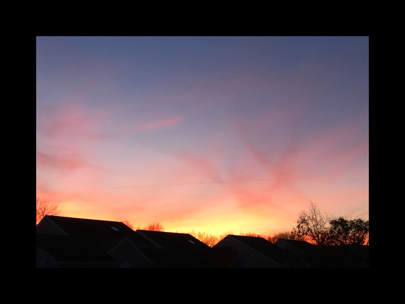 Photo titled Sunset Over Roofs